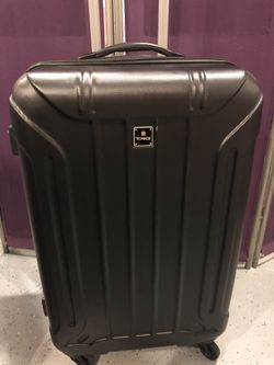 TAG Carry On suitcase with four spinner wheels