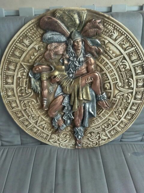 Aztec warrior carrying a woman in color