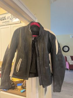 Leather motorcycle jacket (includes free pair of Harley Davidson riding boots)