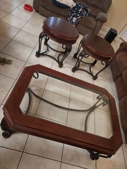 Oval Coffee table solid wood and metal design with center glass and two sides tables set. heavy duty construction located on orange city FL
