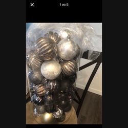 large package of Christmas Ornaments for the Christmas tree in gold, black and silver
