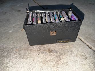 This item is an official vintage Nintendo Entertainment System (NES) game cartridge carrying case, typically designed to hold either 10 or 15 game car