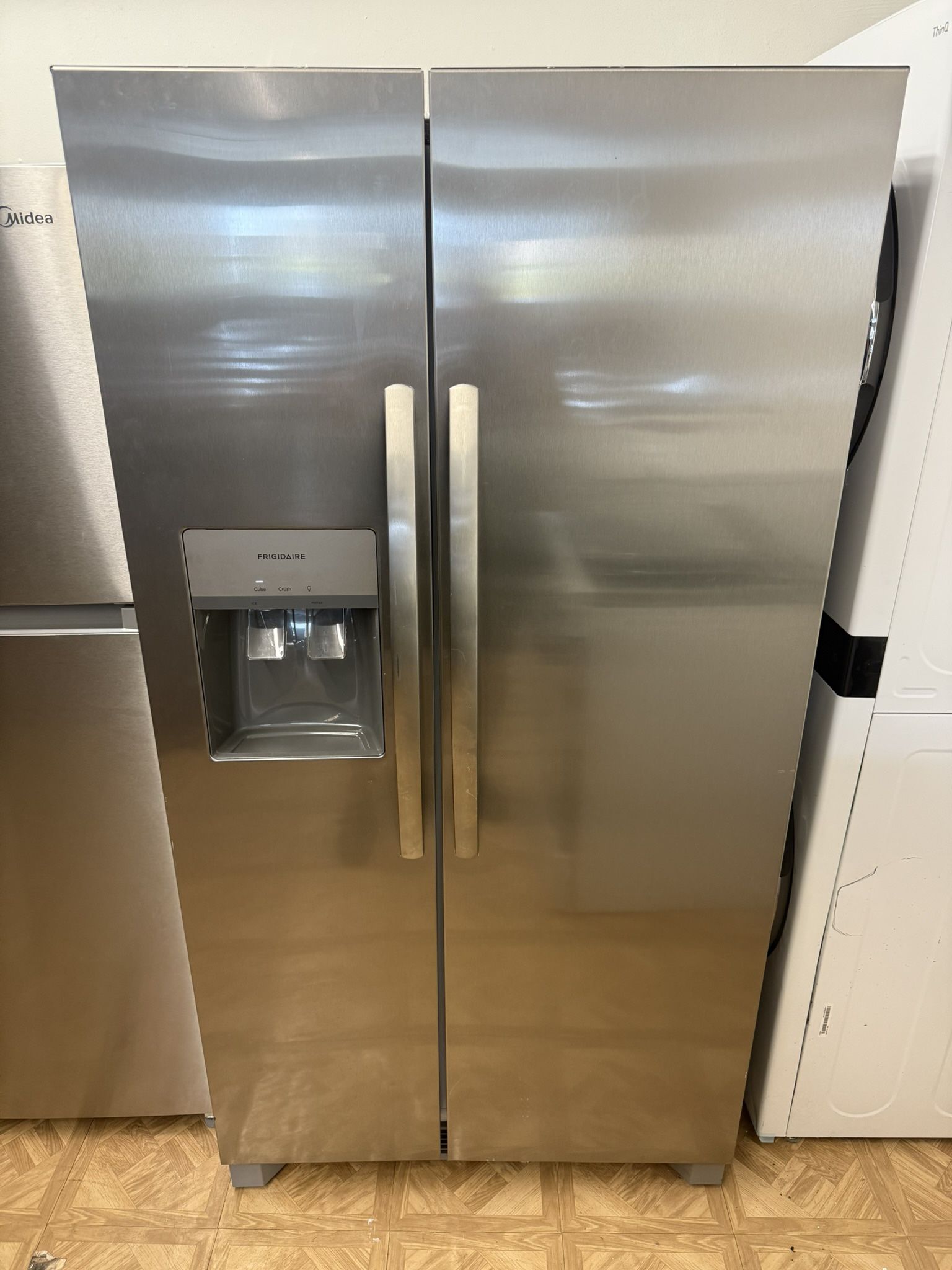LIKE NEW FRIGIDAIRE SIDE BY SIDE STAINLESS STEEL REFRIGERATOR .