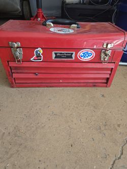 Small tool box with miscellaneous tools.
