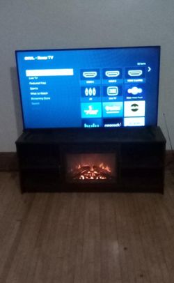 65 Inch Tv Plus A Tv Stand With Fire Place Heater 
