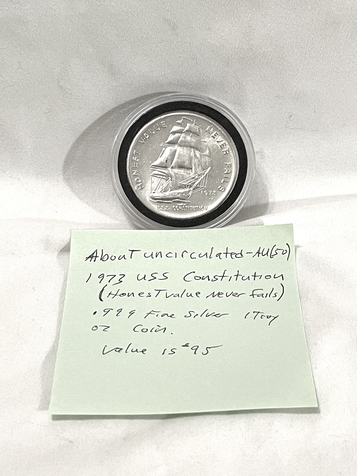 Great Condition Sealed In Capsule 1973 (Uss Constitution) .999 Fine Silver One Troy Oz. Silver Round Proof. This is valued at $95.