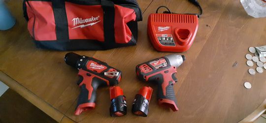 Milwaukee impact drill 2 batteries charger and bag