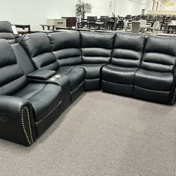 New Reclining Sectional .  Black Leather .  111” X 98”.  Free Delivery !