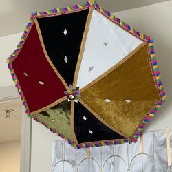 Beautiful decorative umbrella with built-in lights. This umbrella is designed for party decoration, events, or home décor. The lights create a glowing