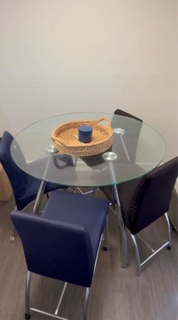 Round glass table with chairs
