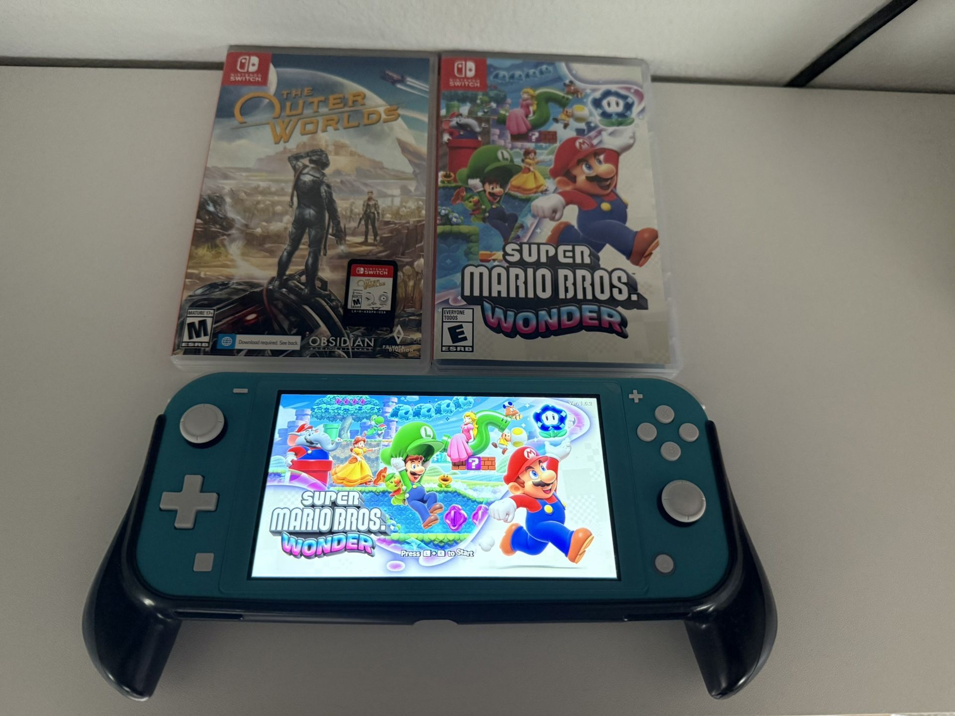Switch Lite with Grip and 2 Games **No Trades**