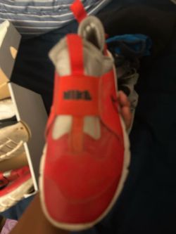 2 pair of nike run shoes reed and black