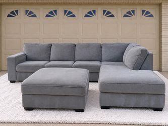 DELIVERY AVAILABLE  2 - piece gray sectional couch with oversized ottoman