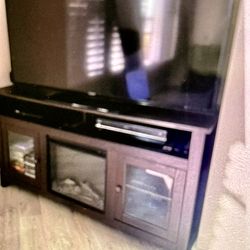TV Stand with Built-In Electric Fireplace + 60” smart TV. Like new! Local Delivered is possible.