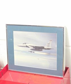 Actually photograph of an F-15 Eagle Jet launching a missile in flight
