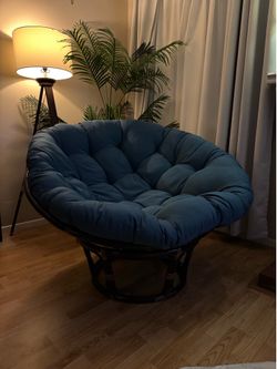 Papasan chair with teal cushion