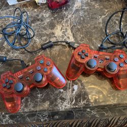 Red translucent PS3 controllers (pair) + 2 USB cables