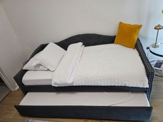 Extra Twin double bed new with mattress.