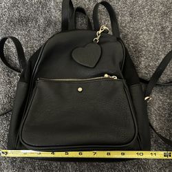 Black Backpack With Heart Tag