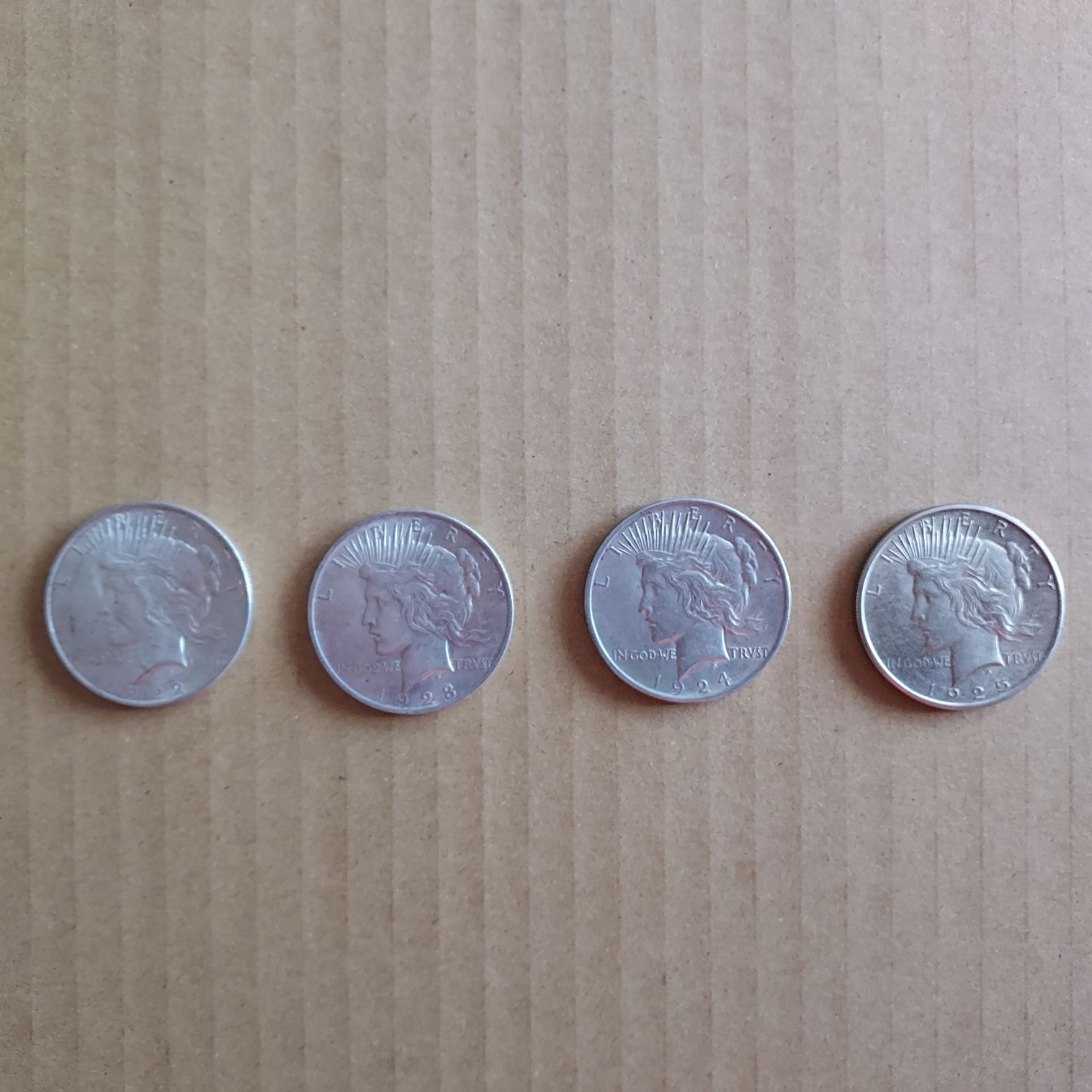 4 Peace Silver Dollars