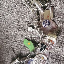 Vintage Sterling Silver Charm Bravcelet With Sterling Silver Charms.