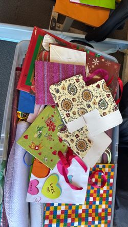 Bin of wrapping paper and gift bags
