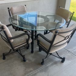 Table for 4 With Glass Top & 4 Chairs With Wheels!