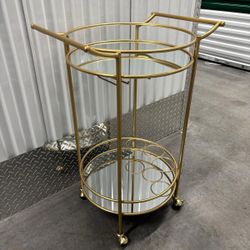 Gold Mirrored serving Bar Cart on wheels.. 21” x 29 “.. $125