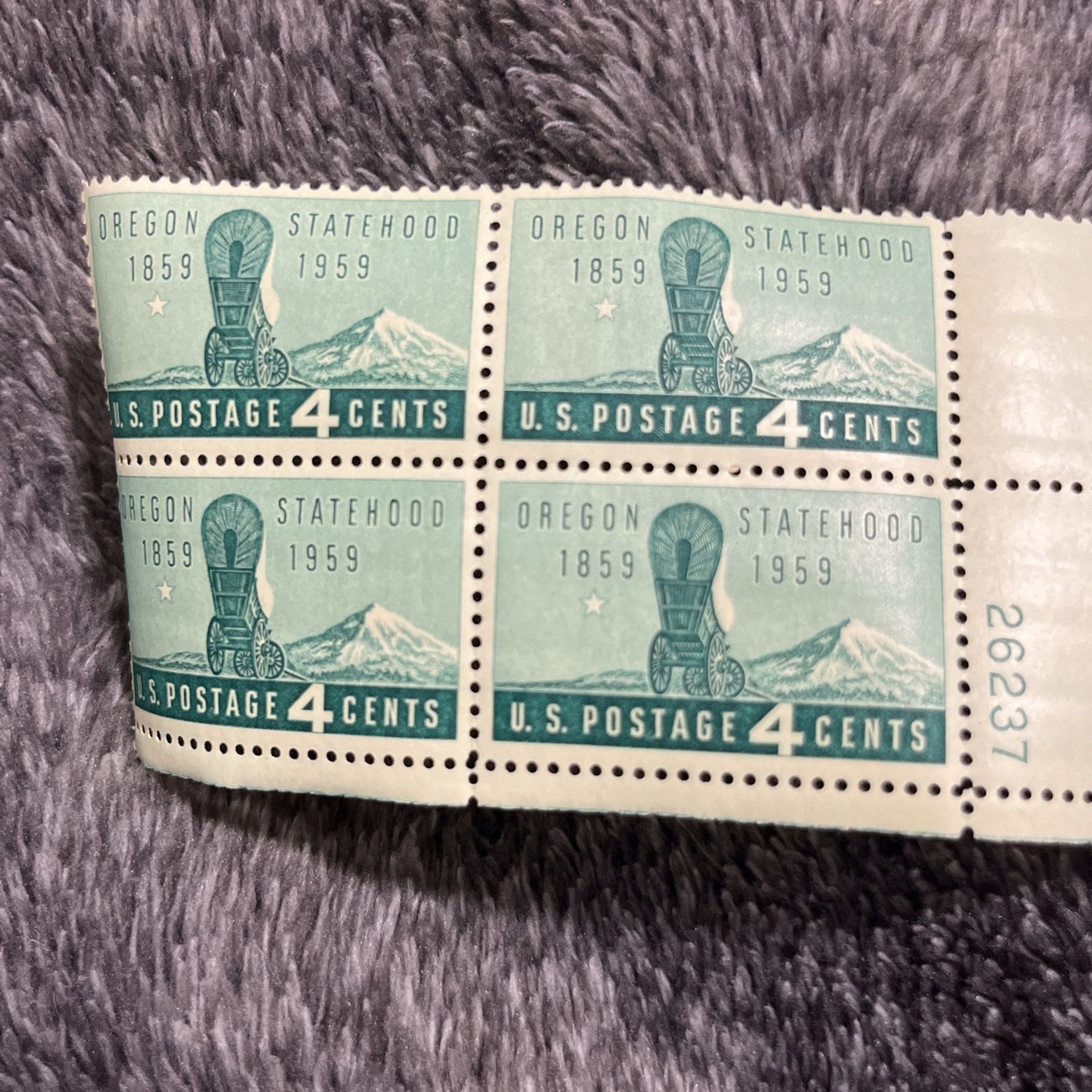This is a block of four 4-cent U.S. postage stamps issued in 1959 to commemorate the 100th anniversary of Oregon statehood. 