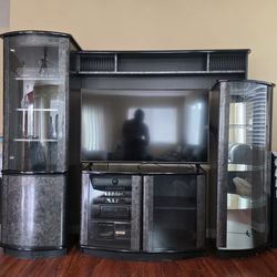 Black entertainment center with glass display cabinets (TV NOT INCLUDED)