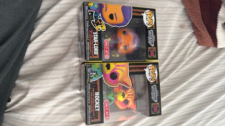 Star lord and Rocket black light Funko pops