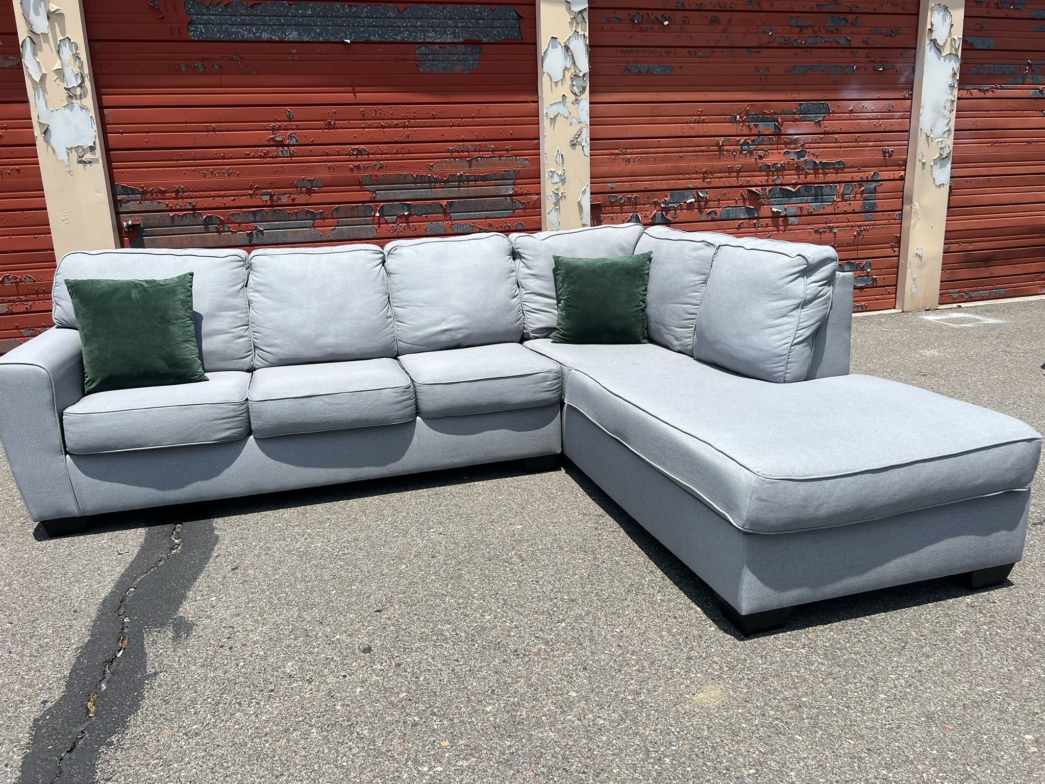 Ashley’s Gray Sectional Sofa Couch with right facing chaise
