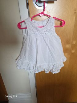 White baby girl dress with lace details and ruffles. Size: 18 months
