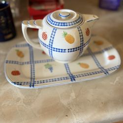 vintage porcelain teapot and underplate set