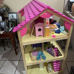 Barbie Three-story doll’s house with furniture, dolls and clothes. 