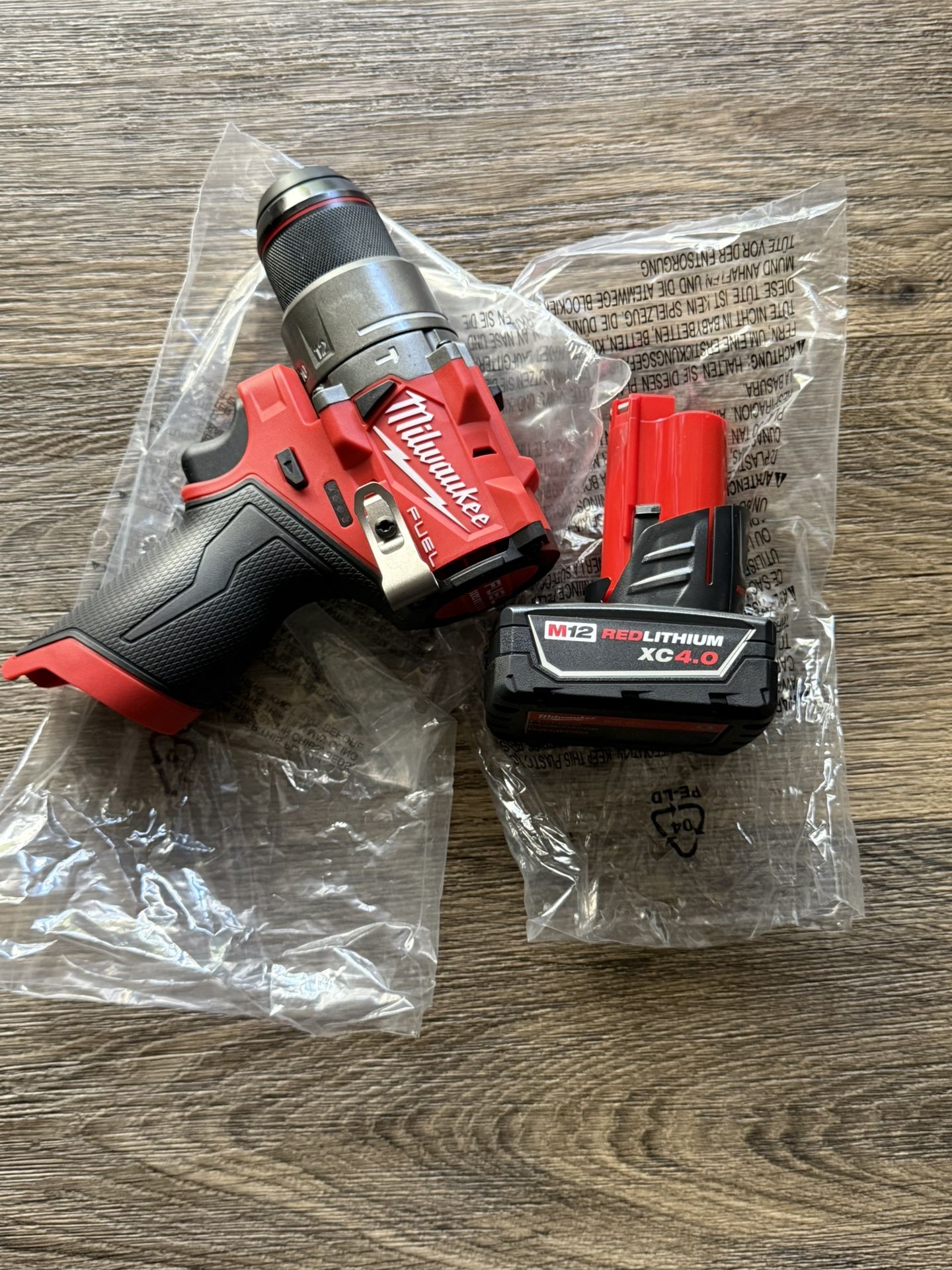 Milwaukee M12 FUEL 12V Lithium-Ion Brushless Cordless 1/2 in.hammer Drill Driver with one battery 4.0ah Price is firm $120