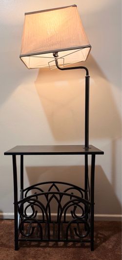 Black metal side table with built-in lamp and magazine rack stylish
