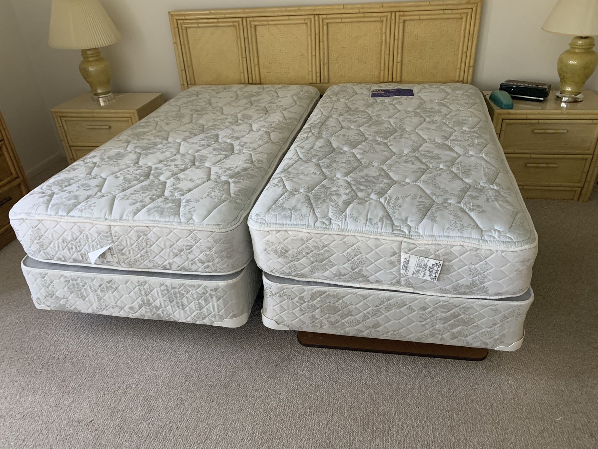 Two twin mattresses with box springs and bed frames. Both in excellent condition.