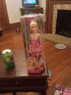 Brand new Barbie doll with big hoop earrings she's from the Barbie movie firm price $20 pick up only 865 Ellsworth avenue right off of East Livingsto