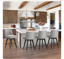 Four Roman 67 cm (26.5-inch) counter-height swivel bar stools, upholstered in gray fabric, with solid wood legs and a backrest.