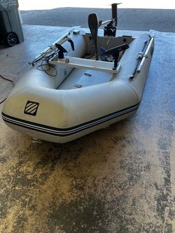 Inflatable fishing boat with motor and fish finder