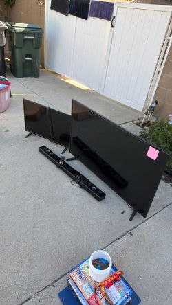 Two Flat Screen TVs with Soundbar