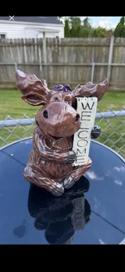 Mr. moose welcomes you statue