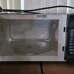 this is a Rival Countertop Microwave Oven in black.