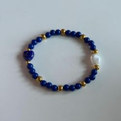 Elegant Handmade Blue Beaded Bracelet with Gold Accents and Glass Heart Charms