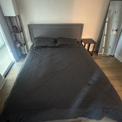 Grey bed frame with drawers