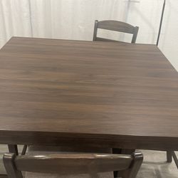 Four chairs and table 47" wide 47" long 36" tall