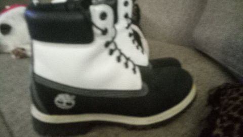 White and Black Timberland work boots.