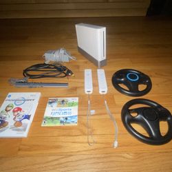 Nintendo Wii (All cords and Mario kart wii included)