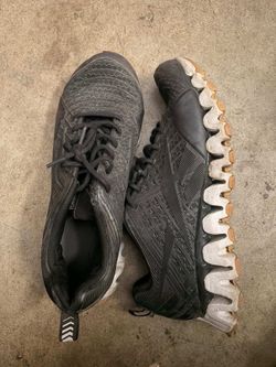 pair of black Reebok ZIGTECH athletic shoes